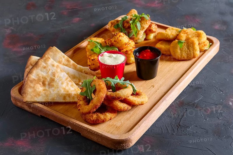 Wooden plate with snack for beer