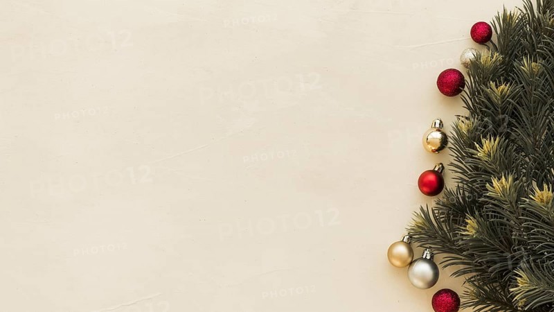 Green fir tree branches with baubles