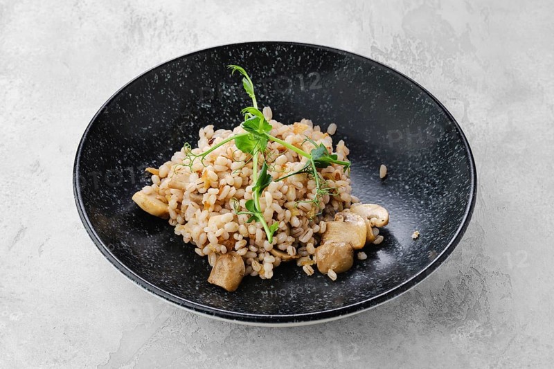 Boilet pearl barley with fried mushrooms