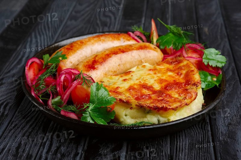 Fried homemade sausage with fried mashed potato