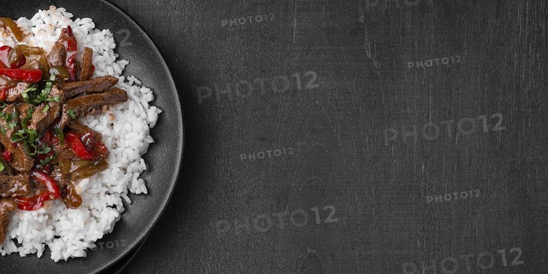 Flat lay of traditional asian rice dish with meat