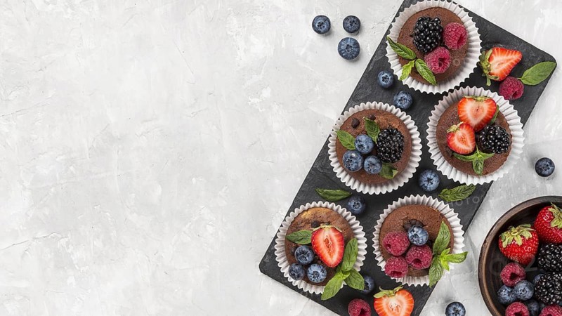 Flat lay tasty muffin with forest fruit