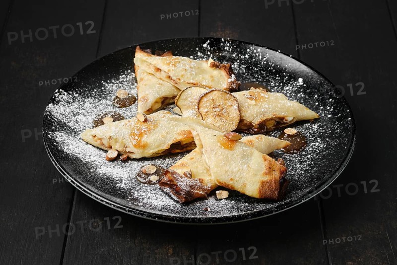 Thin pancakes stuffed with pear