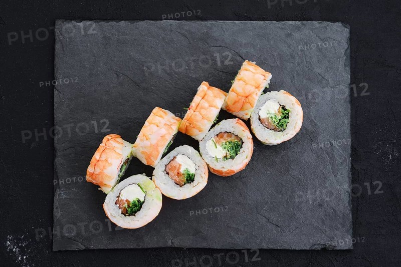 Rolls with shrimp and cream cheese on slate plate