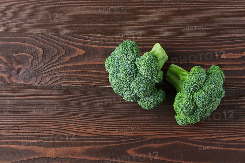 Broccoli on dark wooden background