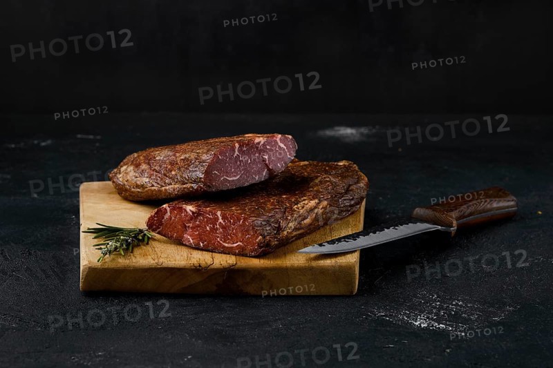 Smoked beef striploin meat on cutting board