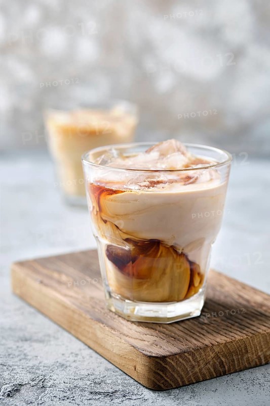 Iced coffee with fat cream in rocks glass