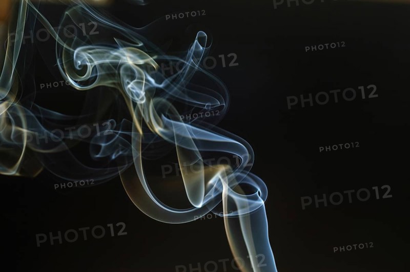 Trajectory of incense smoke in the air showing different shapes. France
