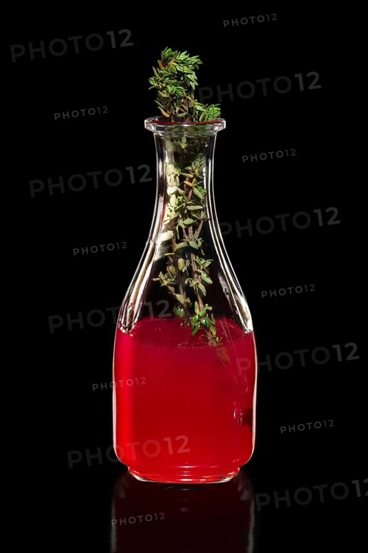 Fresh cranberry juice as ingredient for vodka cocktail isolated on black