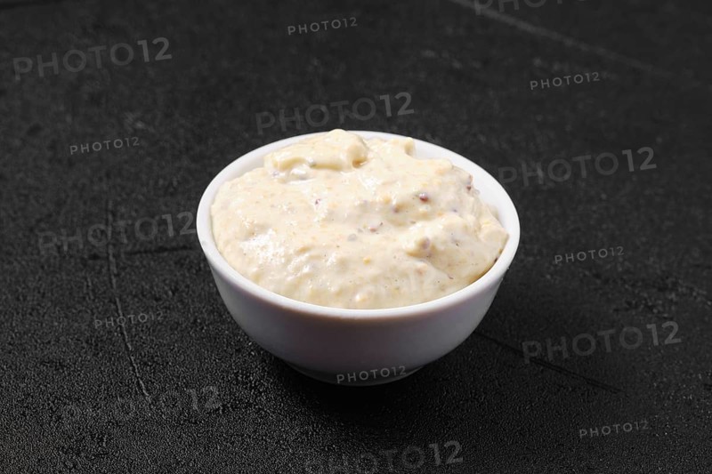 Small bowl with caesar sauce for salad