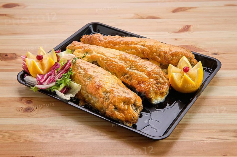 Baked fish in batter on tray