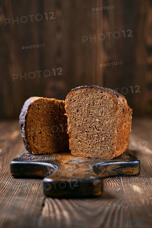 Loaf of artisan rye bread cut on half