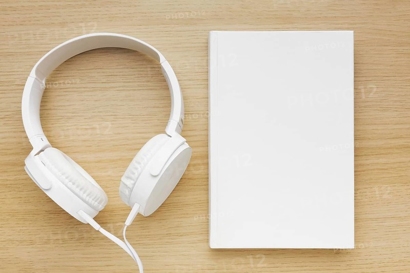 Headphone beside book