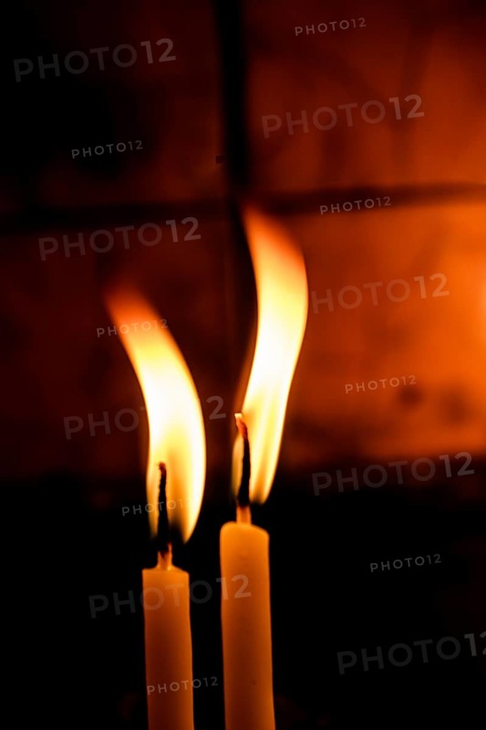 Burning candle making light in view