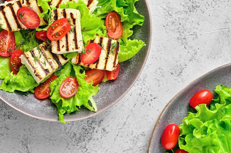 Top view of salad with grilled cheese