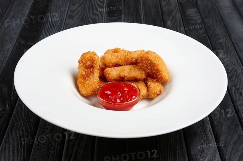 Deep fried chicken nuggets on a plate