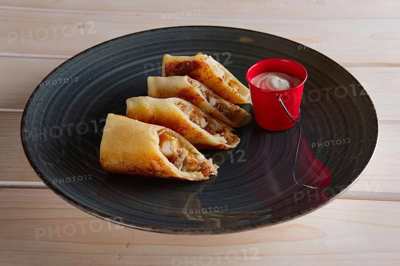 Thin pancakes with ham