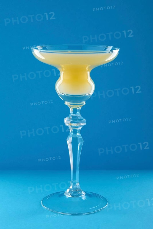 Old Cuban cocktail on blue background