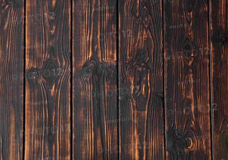 Abstract burnt wooden plank background
