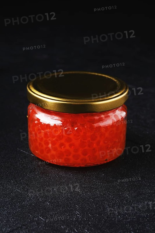 Jar with pink salmon red caviar