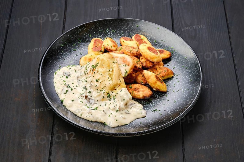 Roasted chicken fillet with gnocchi and mushroom sauce