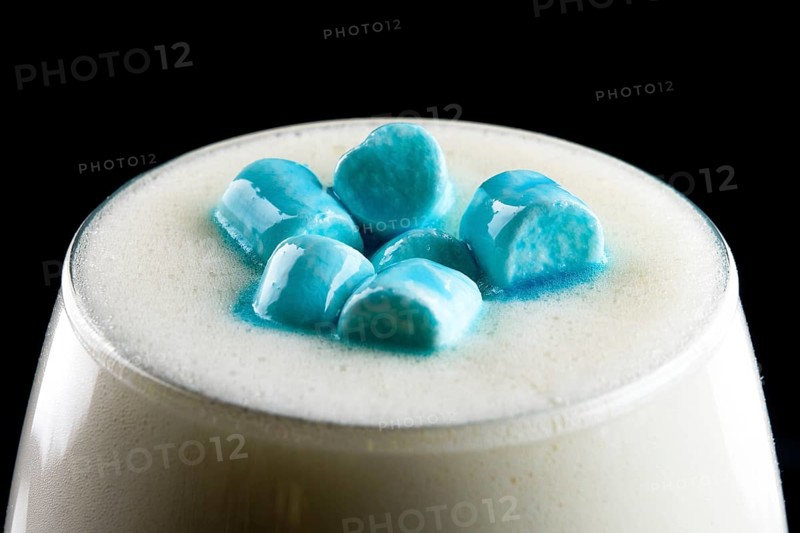 Macro photo of cappuccino with marshmallows topping.
