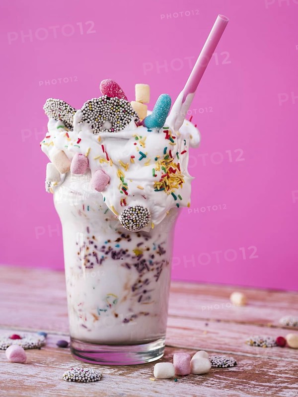 Front view delicious milkshake wooden table