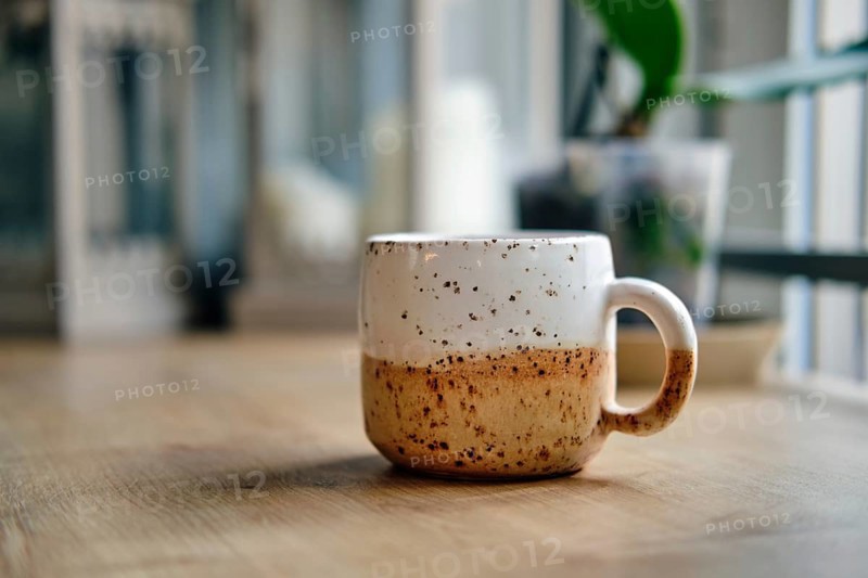Scandinavian style ceramic cup on wooden table