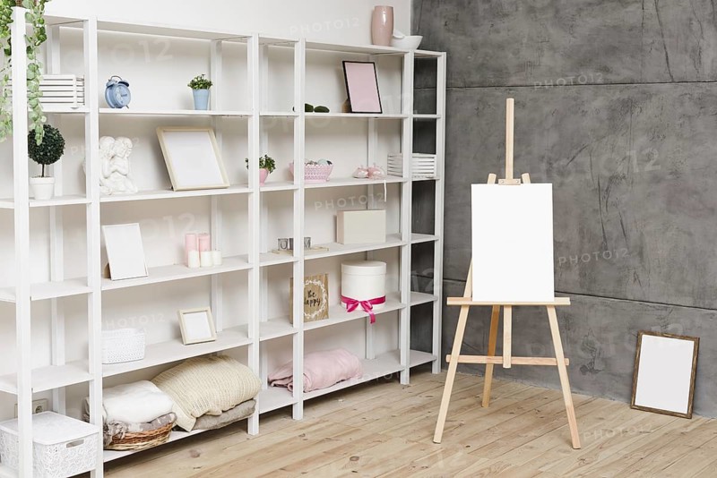 Modern bright bookshelf with decoration
