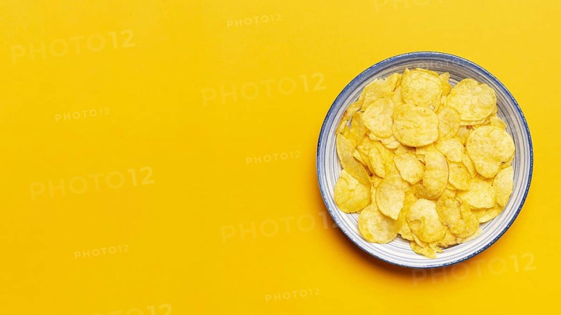 Top view chips bowl yellow background. Resolution and high quality beautiful photo