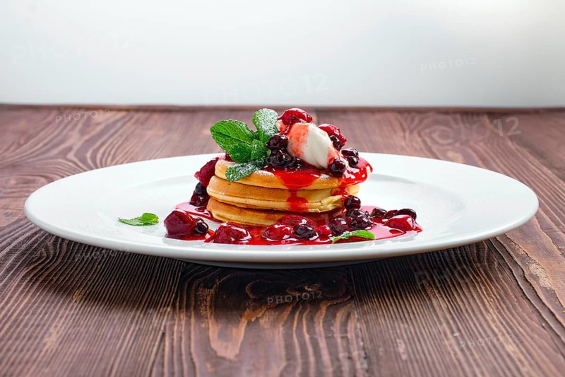 American pancakes with strawberry and black currant jam