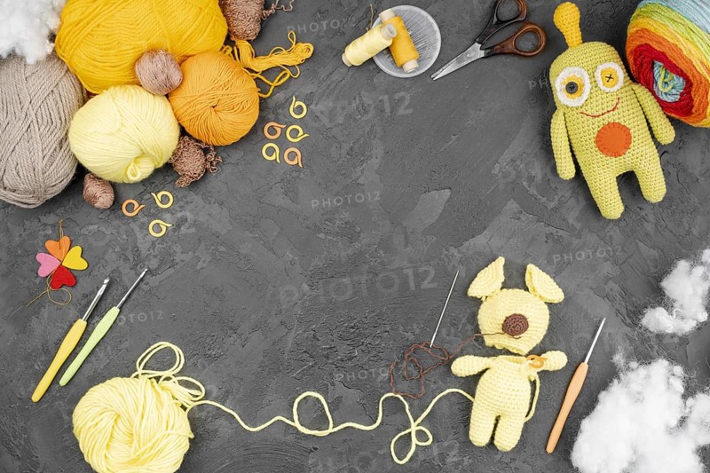 Colored wool with dolls copy space