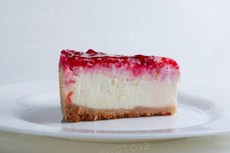 Portion of cherry cheesecake on a plate