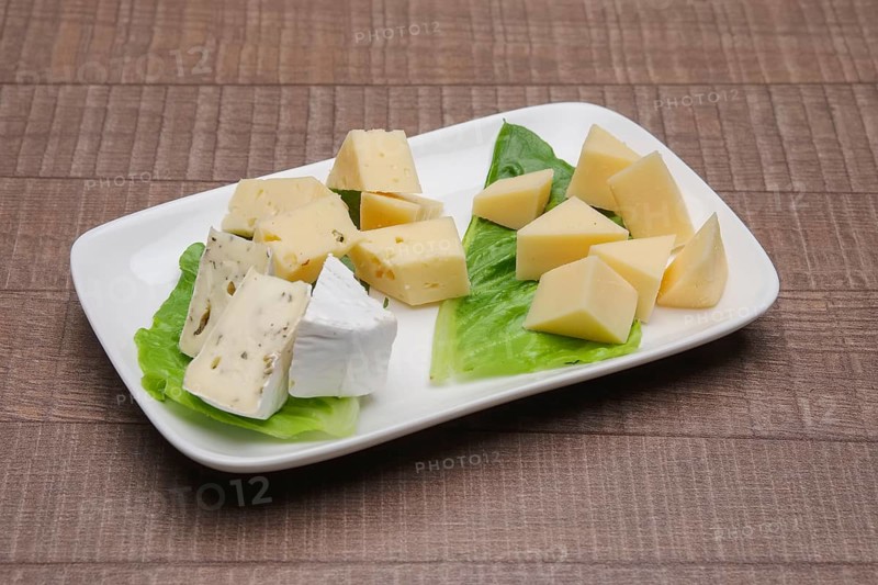 Plate with three kinds of cheese. Cheeseboard