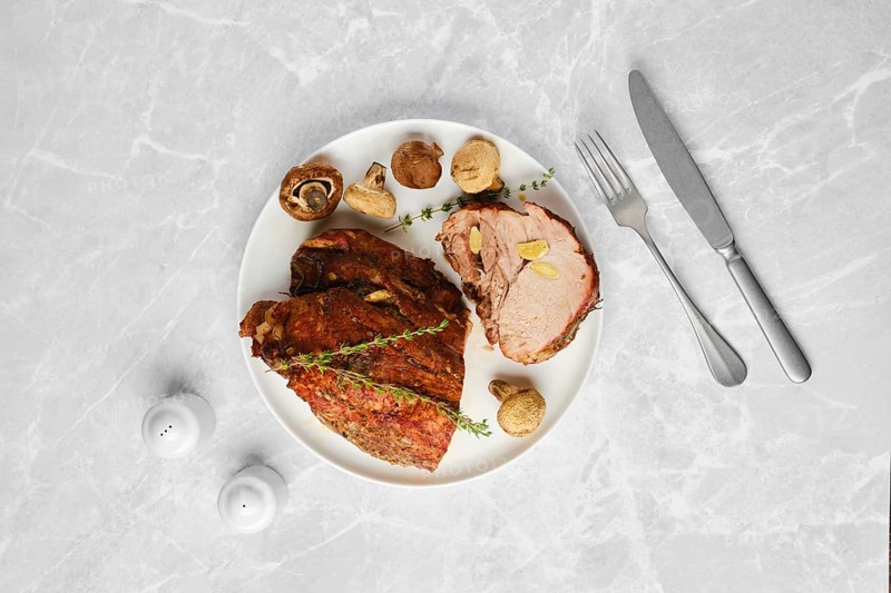 Overhead composition of roasted spicy pork neck