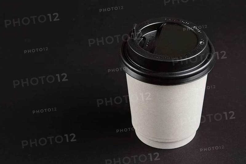 Cardboard cup with lid. Place for text