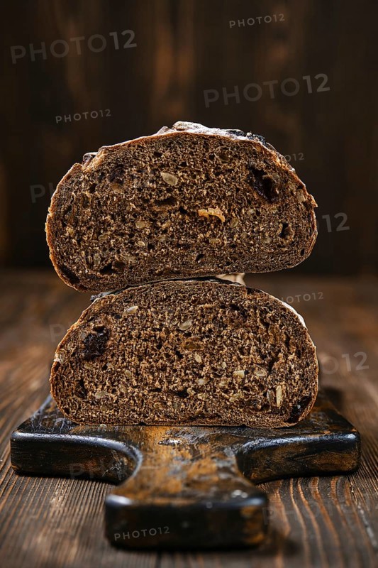 Closeup view of fresh rye brown bread on wooden cutting board