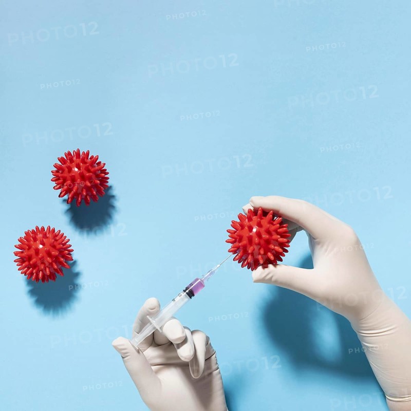 Top view hand holding virus with syringe. Resolution and high quality beautiful photo