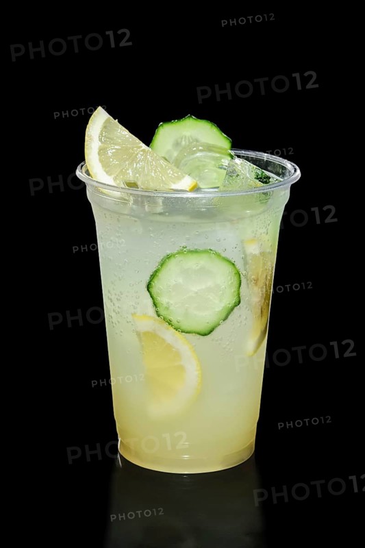 Take away glass with lemon and cucumber lemonade isolated on black