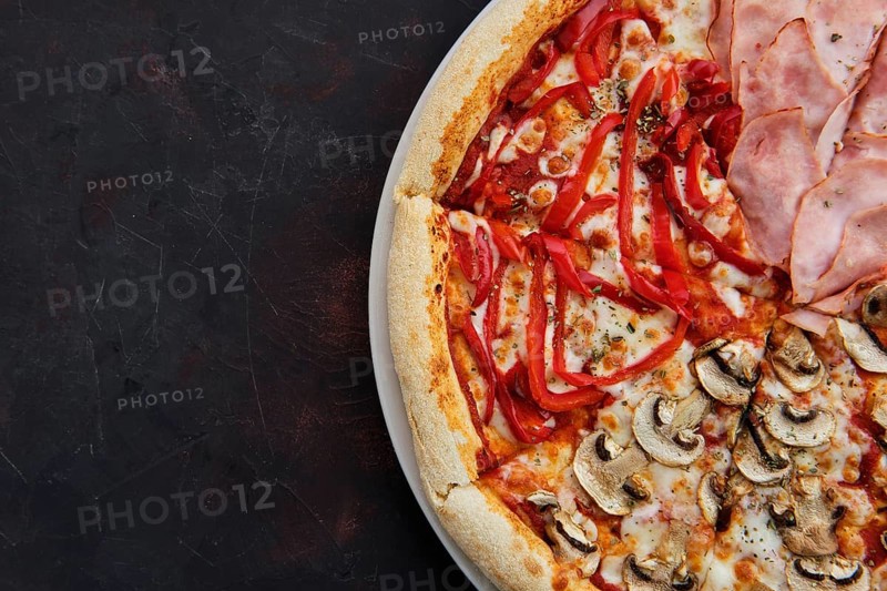 Close up view of pizza four seasons with mushrooms