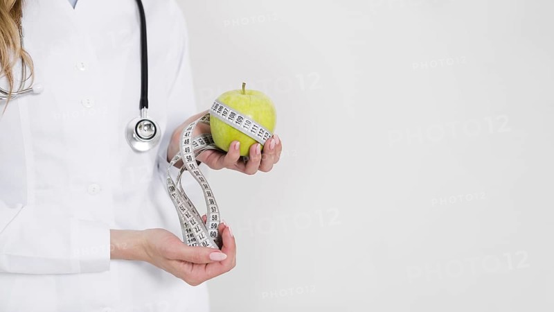 Diet concept with female scientist healthy food