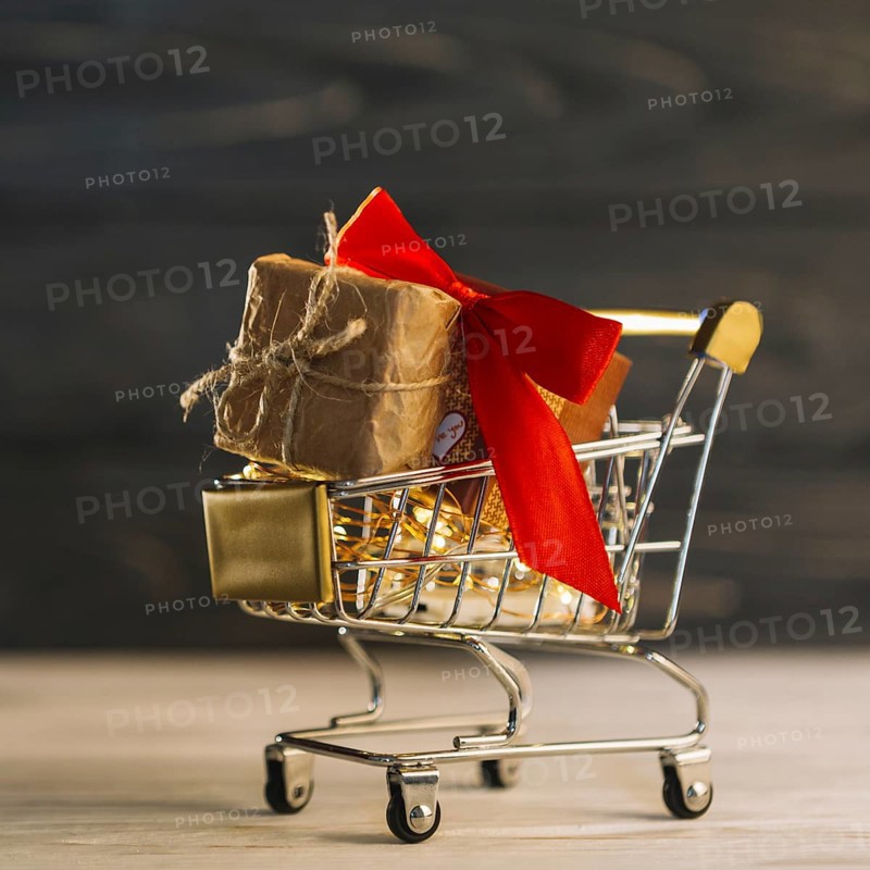 Small grocery cart with gift box with red band. Resolution and high quality beautiful photo