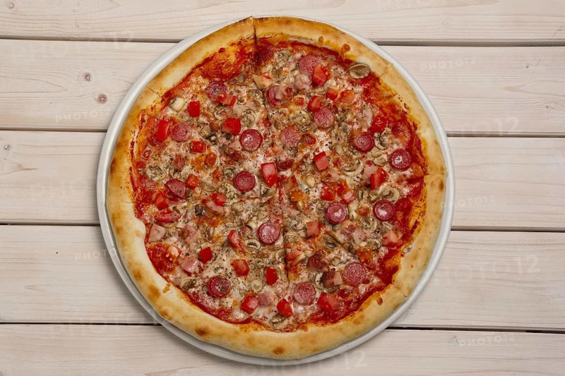 Top view of pizza pepperoni on wooden table