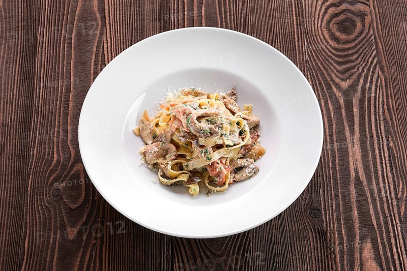 Pasta with bacon and squid