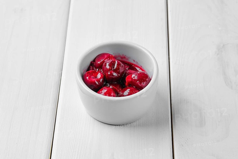 Cherry sauce in ceramic gravy boat