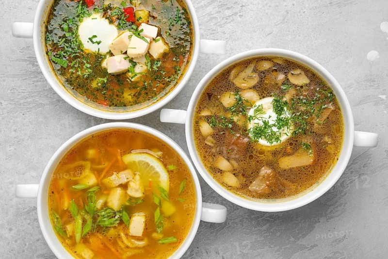 Overhead view of three kinds of healthy soup