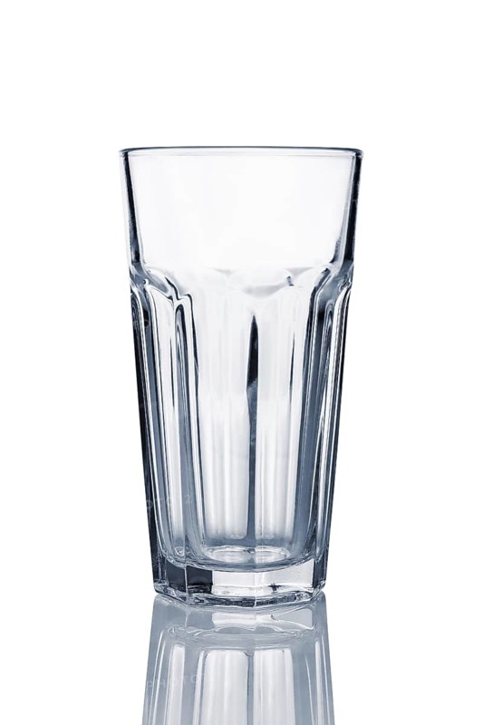 Empty transparent cuba libre glass with reflection isolated on white