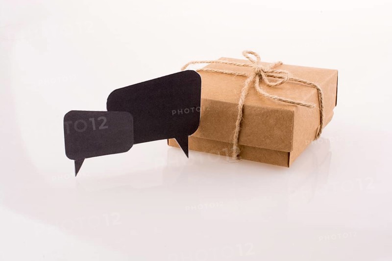 Dialogue boxes near a carton box on a white background