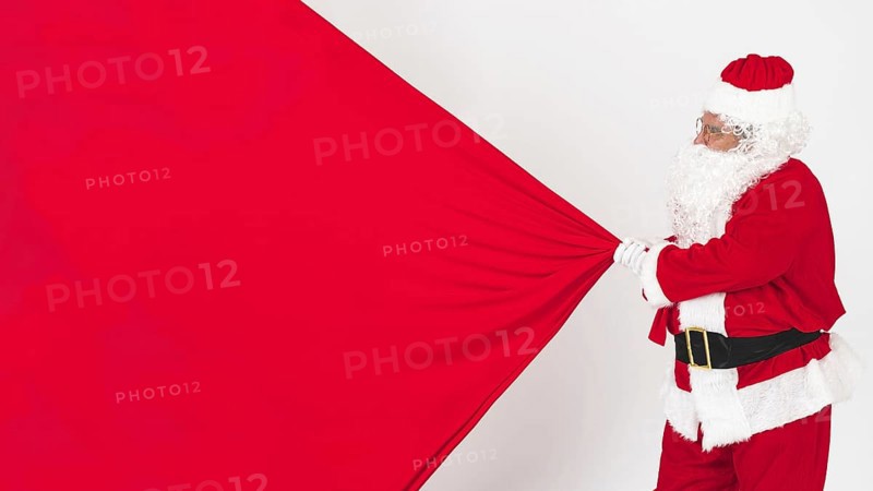 Santa claus pulling christmas bag. Resolution and high quality beautiful photo