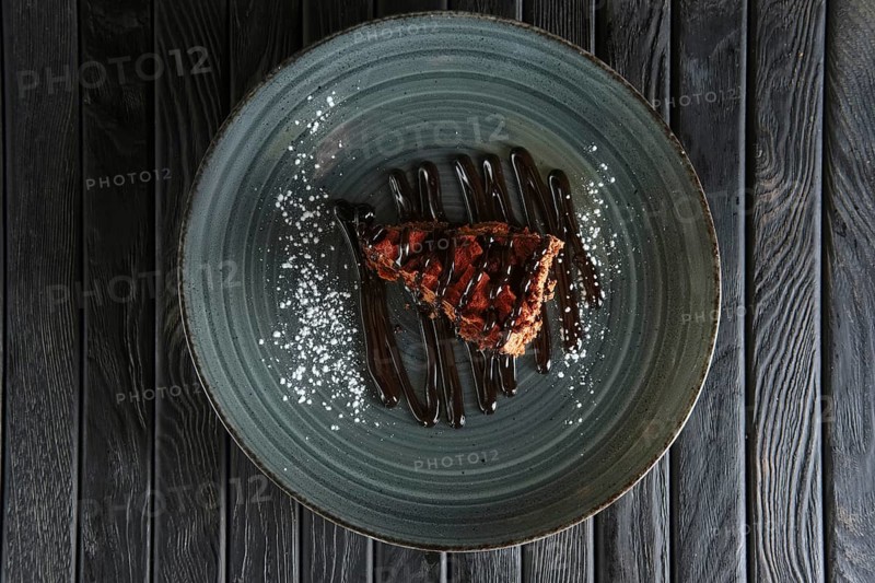Piece of puffy chocolate cake and souffle. Top view